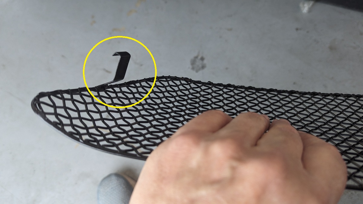 Second clip on the other side of the grille.