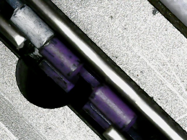 The purple and white are the two ends of the spacer ring