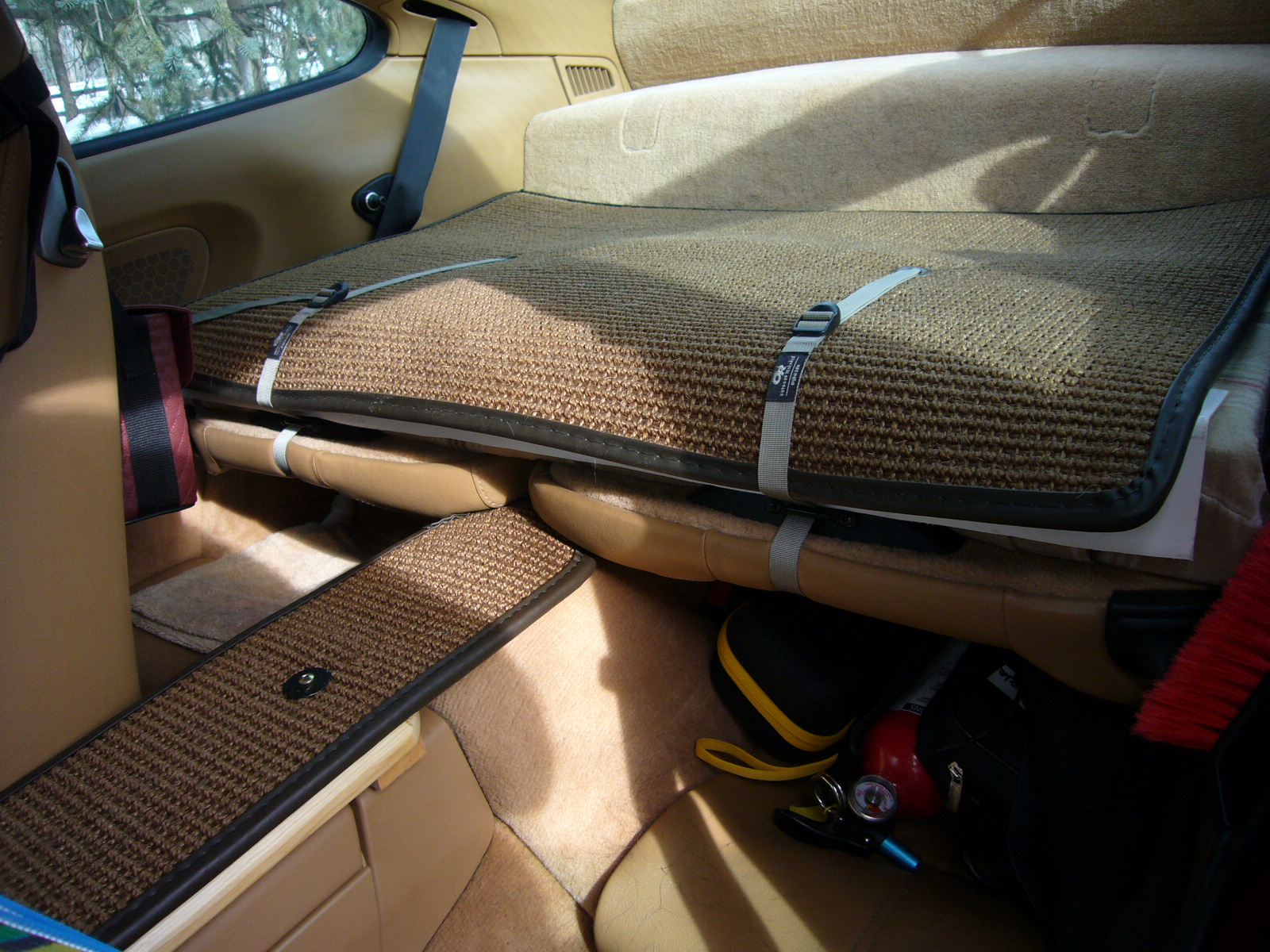 I built the rear seat backs up with a strip of 3" foam before covering with the coco mat to make it nice and flat for the dogs.