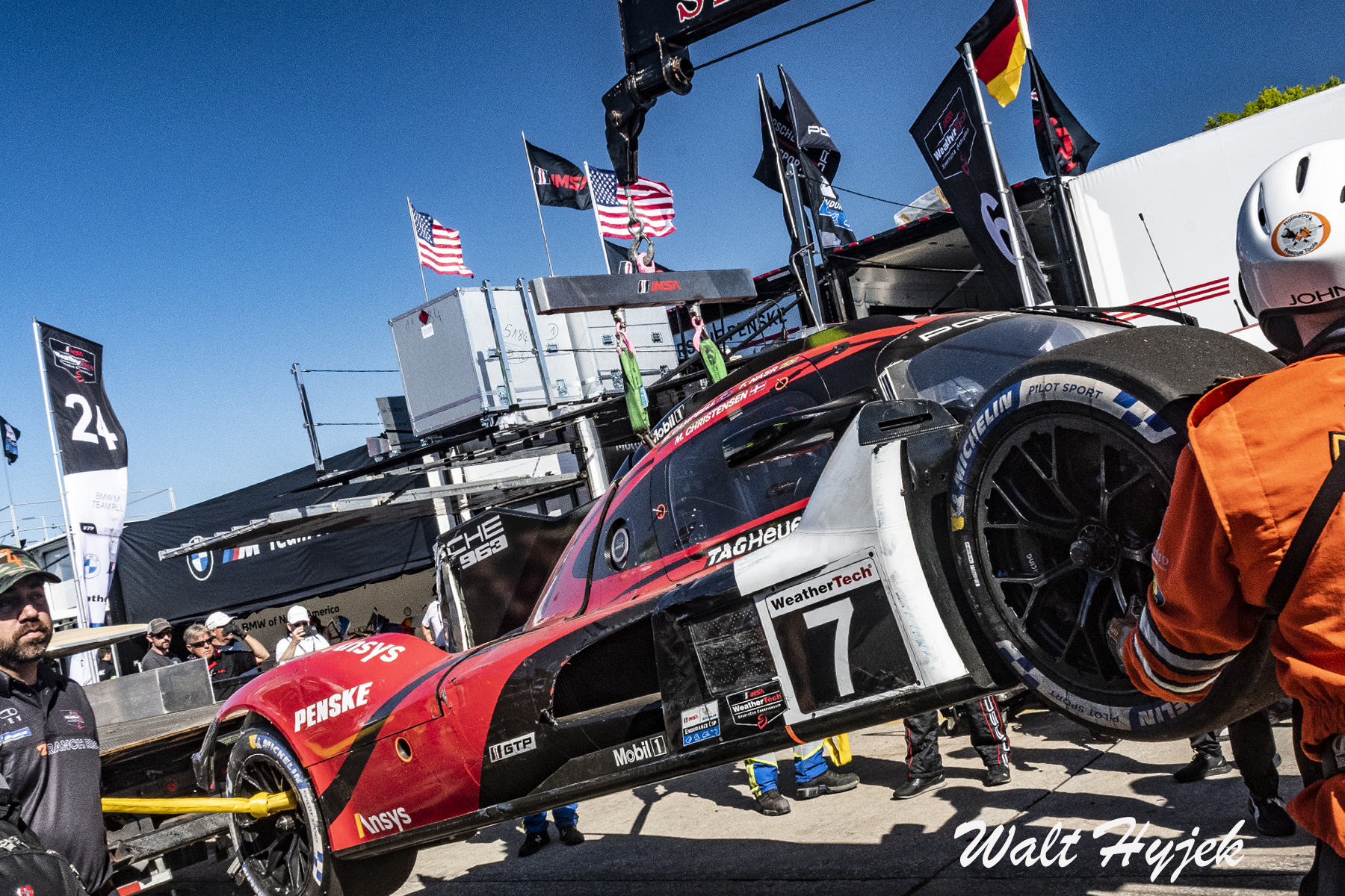 Sebring 2023 Porsche 963 hanging off hauler pit lane CC signed.jpg